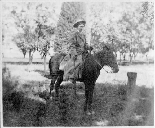 Woman on horse at Petersen House