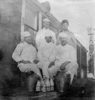 Dairy Employees Posing with Milk Bottles - D.Curtis Standing on Back Left