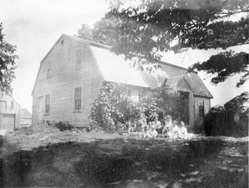 Family Portrait in front of Residential Building with Barn Style Roof - North Reading, Mass.