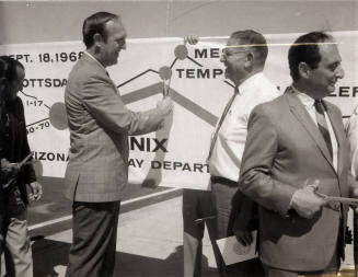 Photograph - Elmer Bradley holding scissors for dedication ceremony.