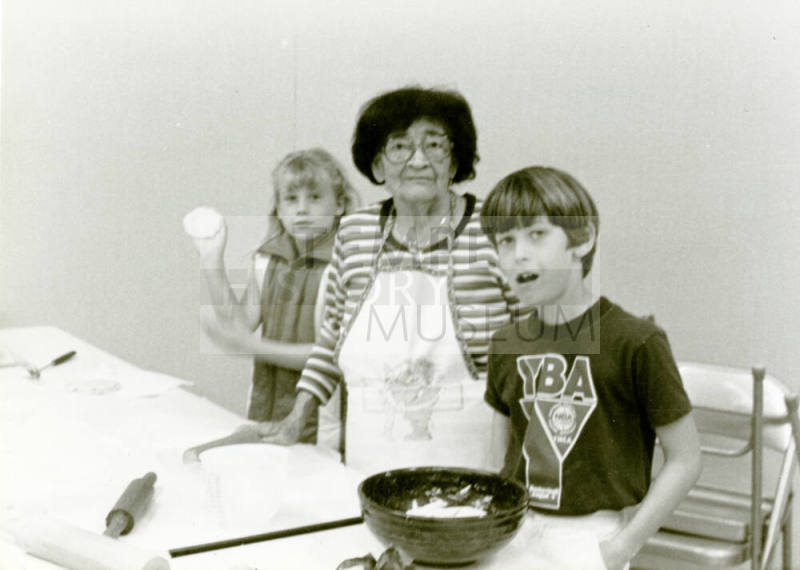 Photograph - Adelina Araiza demonstrating making tortillas