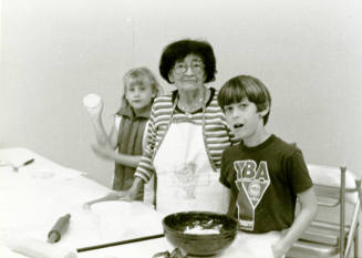 Photograph - Adelina Araiza demonstrating making tortillas