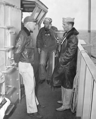 Ernie Pyle on bridge of escort carrier CVE 92 prior to going ashore on Ie Shima where he was killed by sniper on April 18, 1945