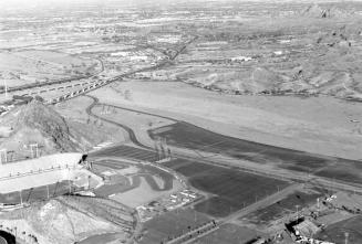 The Salt River with Bridges, A mountain, and Sun Devil Stadium