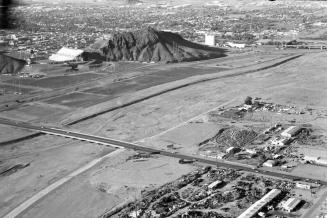 Aerial of A mountain, Salt River riverbed, and Rural Road bridge