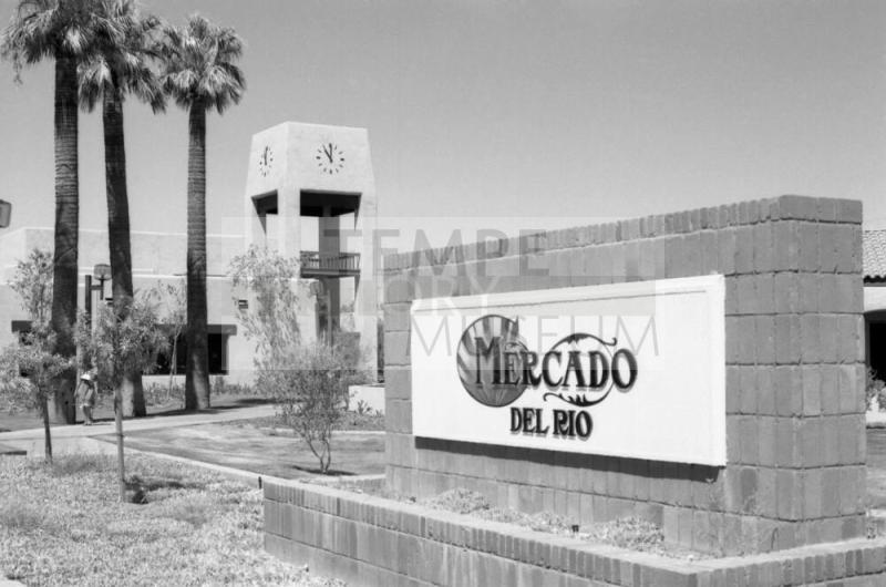Mercado Del Rio Sign with America West Clock Tower
