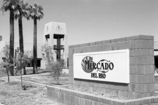 Mercado Del Rio Sign with America West Clock Tower