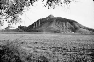 Tempe Butte from north side of the dry Salt River bed, with Sun Devil stadium in left background