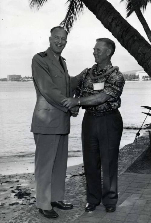 Picture of Clyde B. Smith being presented with a Lei