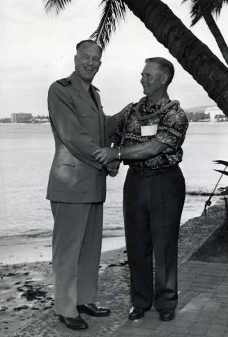 Picture of Clyde B. Smith being presented with a Lei