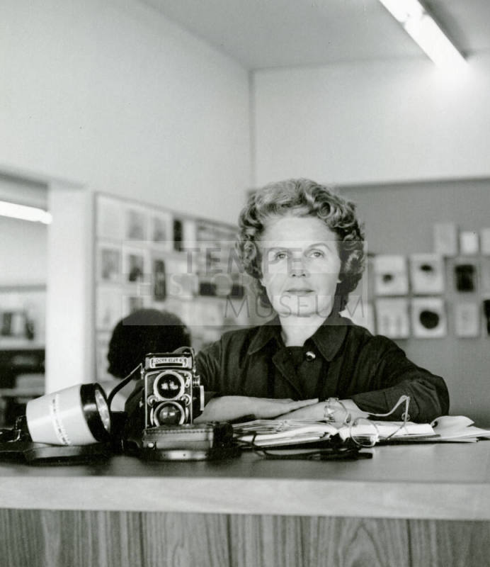 Tempe Daily News photographer Jan Young with a camera