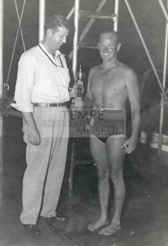 Photograph of Laurence Carr receiving a swimming award