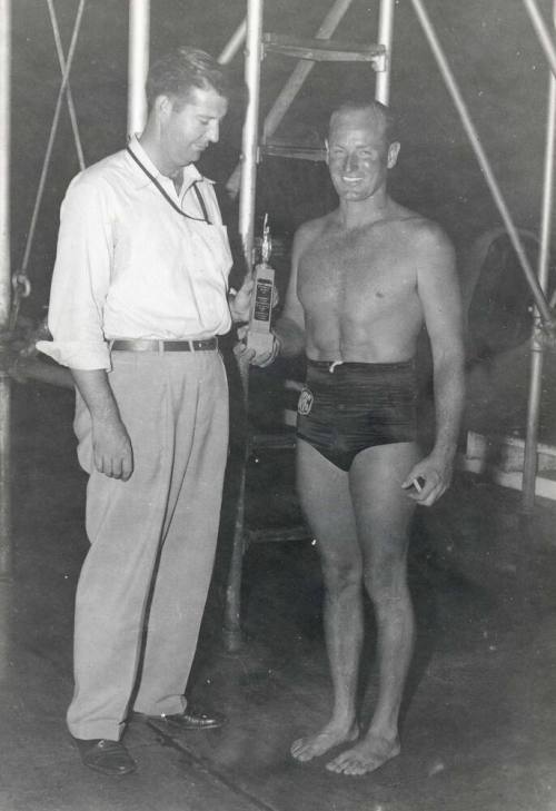 Photograph of Laurence Carr receiving a swimming award