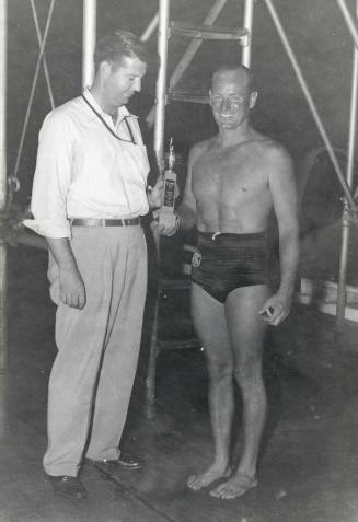 Photograph of Laurence Carr receiving a swimming award
