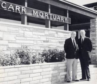 Photo of the Carr Brothers at the Carr Mortuary Entrance