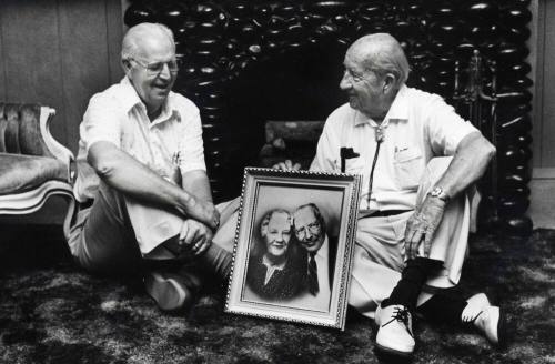 Photo of the Carr Brothers in a Carr Home with their parent’s picture