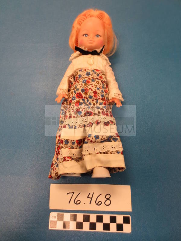 Doll wearing shirtwaist and shirt
