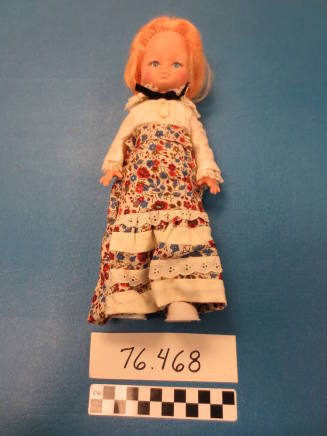 Doll wearing shirtwaist and shirt
