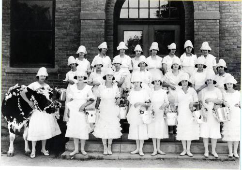 Group of Young Women with Milk Pails and a Cow