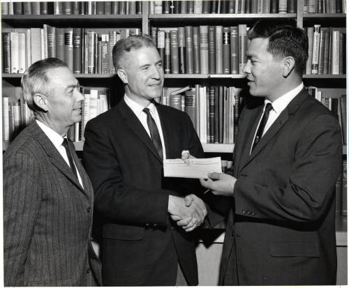 Dr. G. Homer Durham Accepting Check