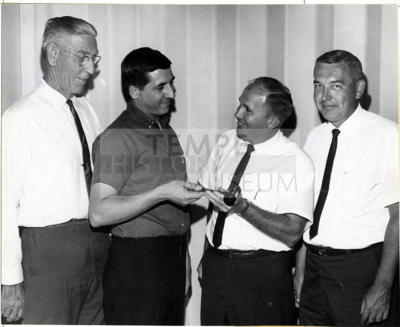 Group of Four Men at a Gavel Presentation