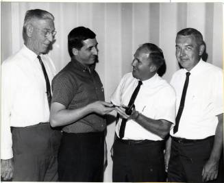 Group of Four Men at a Gavel Presentation