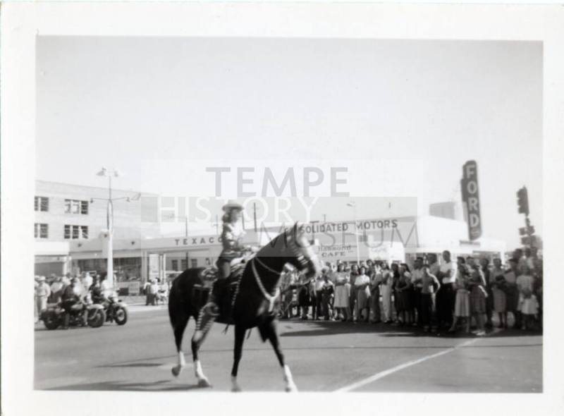 Young Woman on Horseback in Parade