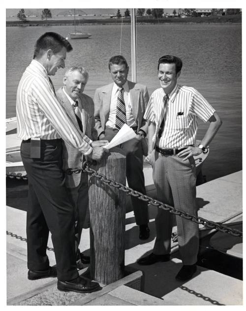 Group of Men at Dock by Lake