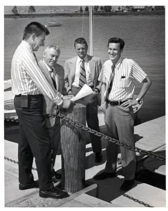 Group of Men at Dock by Lake