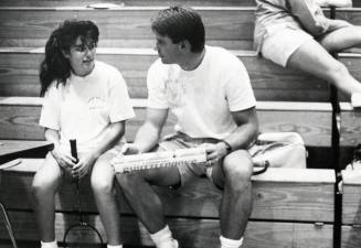 Corona del Sol Badminton Players on bleachers