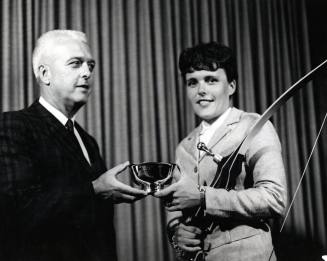 Judy Severance (ASU) receives an award from Art Brooks