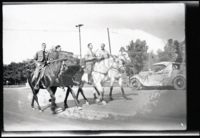 Men in Uniform on Horseback