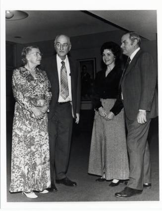 Two couples in campus building