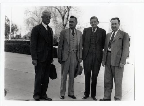 Group of four men on campus