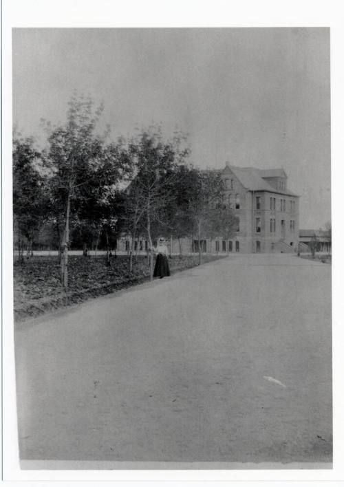 Woman standing by Old Main