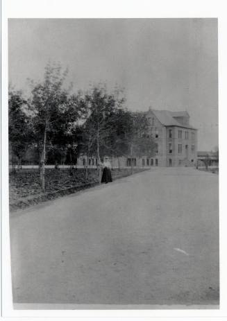 Woman standing by Old Main