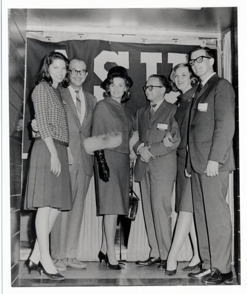 Vonda Kay Van Dyke and five other youn people with ASU banner
