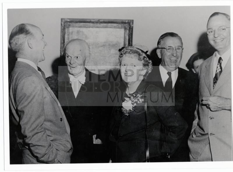 Group of four men and a woman