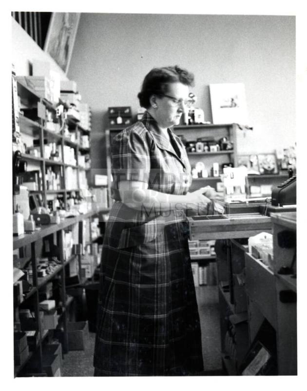 Pioneer Camera - Dorothy Wood behind store counter
