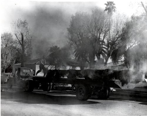 Smoking Bales on Truck Flatbed Trailer in front of Tempe City Hall