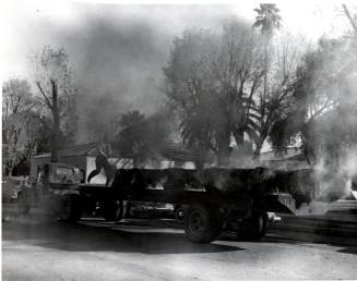 Smoking Bales on Truck Flatbed Trailer in front of Tempe City Hall