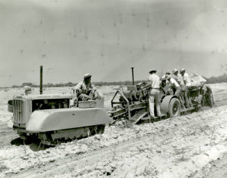 Diesel Caterpillar Tractor and Trailer in Field