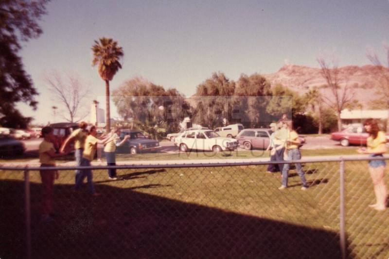 Photograph of people in yard playing by First Congregational Church of Tempe