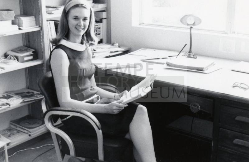 Young Girl at an office desk