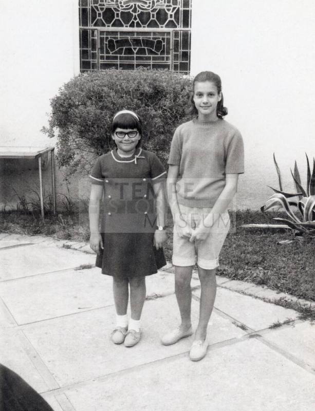 Two First Congregational Church Youth standing on pavers