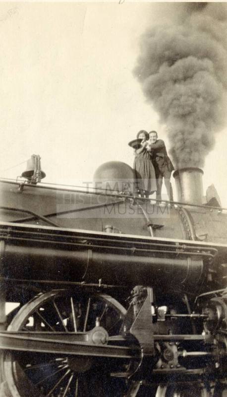 Josie and Harry Madera on a train engine at the Round House in Phoenix
