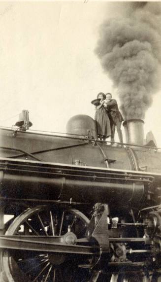 Josie and Harry Madera on a train engine at the Round House in Phoenix