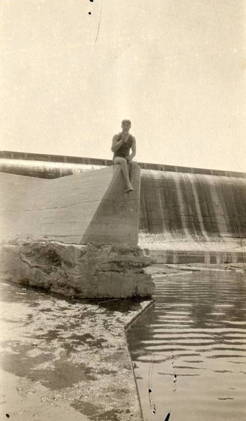 A man sitting on part of Granite Reef Dam