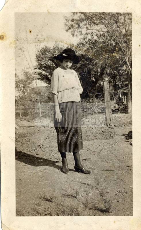 Teen age girl standing in a year
