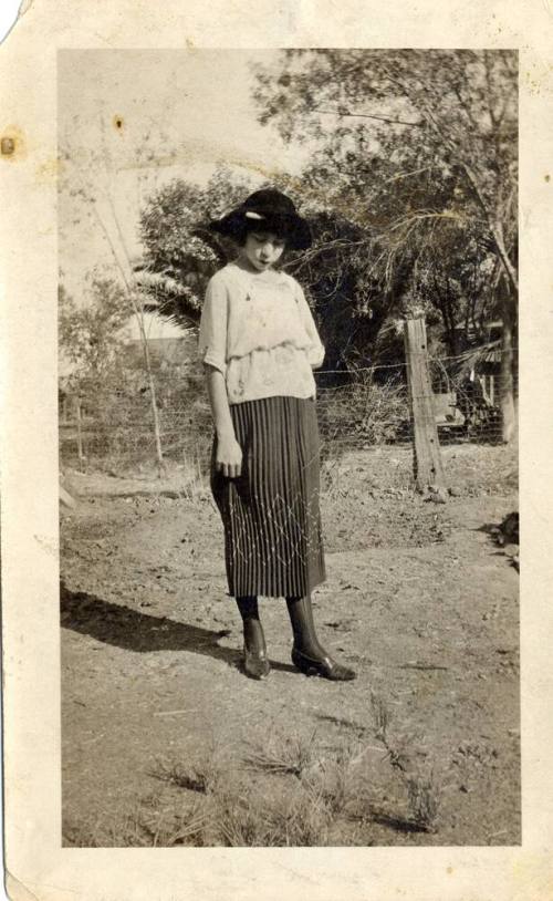 Teen age girl standing in a year